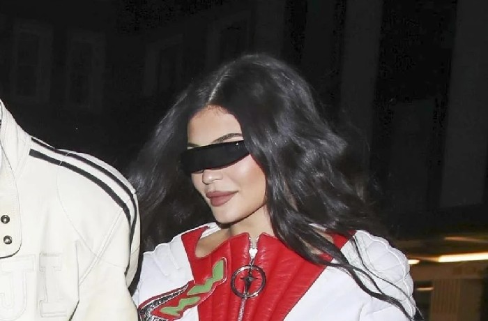 Kylie Jenner wears a denim miniskirt with Travis Scott in London