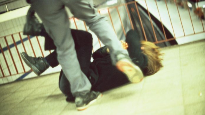 Man Kicking a Woman in Subway Station