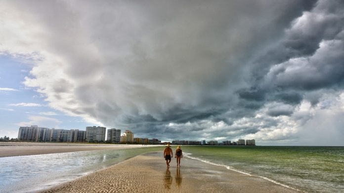 Dark Thunderstorm Clouds Loom Over Crescent Beach In Florida